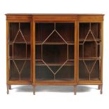 AN EDWARD VII BREAKFRONT MAHOGANY CHINA CABINET, C1905, crossbanded in satinwood and line inlaid,