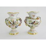 A PAIR OF MEISSEN FLORAL ENCRUSTED OGEE VASES, PAINTED TO EITHER SIDE WITH BIRDS ON A BRANCH OR