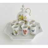A MEISSEN SCHNAPPS SET, PAINTED WITH LOOSE BOUQUETS AND INSECTS, COMPRISING TRAY, 22CM L, BULBOUS