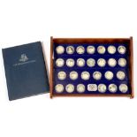 THE NEW ELIZABETHAN AGE. A SET OF 26 PROOF SILVER COMMEMORATIVE MEDALS, 1977, IN STEPPED DISPLAY