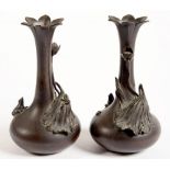 A PAIR OF JAPANESE NATURALISTIC BRONZED METAL BOTTLE SHAPED VASES, APPLIED WITH DYING LOTUS AND