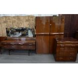 A 1960'S WALNUT FIVE PIECE BEDROOM SUITE, INCLUDING CHEST OF DRAWERS, TWO WARDROBES AND DRESSING