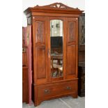 A CARVED MAHOGANY ART NOUVEAU STYLE WARDROBE, 209CM H X 120CM W AND MIRROR BACKED DRESSING TABLE
