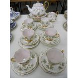 A ROYAL ALBERT PALE PINK AND WHITE TEA SERVICE DECORATED WITH STYLISED LEAVES, PRINTED MARK