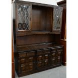 AN OAK DRESSER, THE UPPER PART FITTED WITH GLAZED DOORS, 196CM H X 151CM W