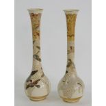 A PAIR OF JAPANESE SATSUMA EARTHENWARE BOTTLE SHAPED VASES, DECORATED WITH BIRDS IN FLIGHT AND A