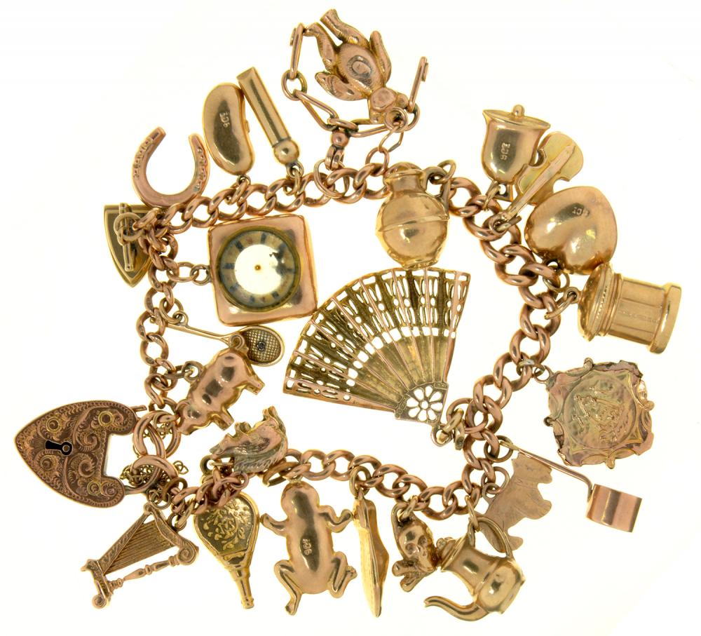 A 9CT GOLD CHARM BRACELET, LINKS INDIVIDUALLY MARKED, WITH A COLLECTION OF GOLD CHARMS, 36G++LIGHT