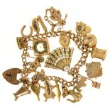 A 9CT GOLD CHARM BRACELET, LINKS INDIVIDUALLY MARKED, WITH A COLLECTION OF GOLD CHARMS, 36G++LIGHT