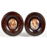 A PAIR OF CONTINENTAL OVAL MINIATURE CONVEX PORCELAIN PLAQUES, PAINTED WITH PORTRAITS OF A KING OR