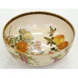 A JAPANESE SATSUMA EARTHENWARE BOWL, DECORATED TO THE INTERIOR WITH FINCHES AND FLOWERS, THE