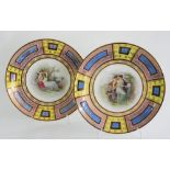 A PAIR OF VIENNA STYLE PORCELAIN WALL PLATES, DECORATED WITH CLASSICAL FIGURES IN PINK AND YELLOW