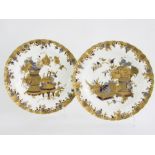 A PAIR OF CROWN DERBY FLUTED PLATES, DECORATED IN TONES OF BLUE AND RAISED, COLOURED GILDING, WITH