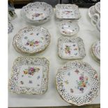 A GERMAN RETICULATED PORCELAIN DESERT SERVICE, PAINTED WITH LOOSE BOUQUETS AND SCATTERED FLOWERS,