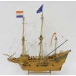 A WOODEN MODEL GALLEON WITH SAILS AND RIGGING AND THREE OTHERS, 68CM AND SMALLER