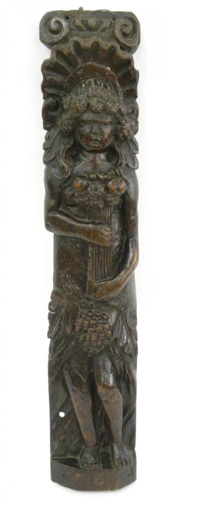 A NORTHERN EUROPEAN CARVED OAK APPLIQUE IN THE FORM OF A LONG HAIRED FIGURE HOLDING FLOWERS, 54CM H,