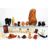 A SMALL COLLECTION OF SOUTH EAST ASIAN MINIATURE WOOD, AMBER AND OTHER CARVINGS, ETC