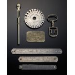 BELK FAMILY. THREE FOLDING STEEL RULES AND A WIRE GAUGE, LATE 19TH-EARLY 20TH C the rules by