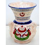 A TURKISH TIN GLAZED EARTHENWARE THREE HANDLED VASE, DECORATED WITH FLAGS, STAR AND CRESCENT, 32CM