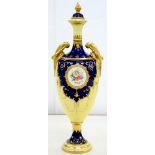 A COALPORT SHIELD SHAPED COBALT AND YELLOW GROUND VASE AND COVER, PAINTED WITH A MEDALLION OF