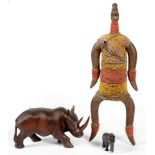 AN AFRICAN CARVED WOOD AND BEADWORK DOLL, 55CM H, A CARVED HARDWOOD SCULPTURE OF A RHINOCEROS AND