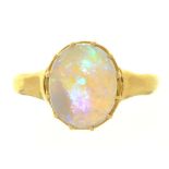 A CABOCHON OPAL RING, IN GOLD MARKED 18CT, 2.5G, SIZE N++LIGHT WEAR CONSISTENT WITH AGE