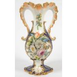 A STAFFORDSHIRE FLORAL ENCRUSTED COBALT GROUND VASE WITH LEAFY EVERTED APRICOT NECK AND SCROLL
