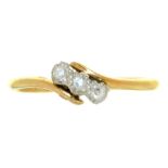 A THREE STONE DIAMOND CROSSOVER RING IN 18CT GOLD, BIRMINGHAM 1938, 2.5G, SIZE N½++LIGHT WEAR