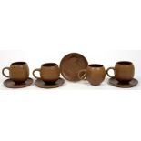 STUDIO POTTERY. A SET OF FOUR GLAZED EARTHENWARE OVOID MUGS AND SAUCERS, LATE 20TH C