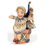 STUDIO POTTERY. A PAINTED AND LUSTRED EARTHENWARE GROUP OF PUNCH AND JUDY, 17CM H, LATE 20TH C