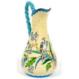 A LONGWY EARTHENWARE JUG DECORATED WITH FLOWERS ON A CRACKLED PRIMROSE GLAZE, WITH TURQUOISE ROPE