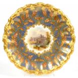 A COALPORT MOULDED DESSERT PLATE, PAINTED TO THE CENTRE WITH A CASTLE IN RAISED GILT SURROUND AND