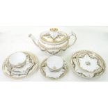 A SPODE PART TEA SERVICE, PAINTED IN SEPIA MONOCHROME WITH SWAGS AND GILT, THE SERVICE INCLUDING