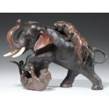 A JAPANESE BRONZE SCULPTURE OF AN ELEPHANT ATTACKED BY TIGERS, MEIJI PERIOD ivory tusks, brown,