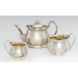 A GEORGE V THREE PIECE SILVER TEA SERVICE of bag shape, 15.5cm h, by Atkin Bros, Sheffield 1912,