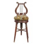 AN EARLY VICTORIAN MAHOGANY HARPIST'S CHAIR the lyre shaped back with brass rod strings, the