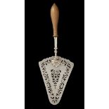 A GEORGE III PIECED SILVER FISH SLICE crested, pearwood handle, 31cm l, by William Plummer, London