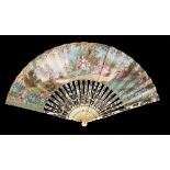 A FRENCH BONE FAN, 19TH C the leaf painted to either side with pastoral scenes in floral borders,