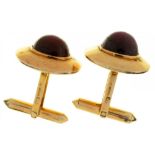 A PAIR OF STAR RUBY CUFFLINKS each cabochon ruby approx 6.5ct, to crosshatch textured gold mounts,