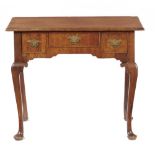 A GEORGE II WALNUT LOWBOY, MID 18TH C the quarter veneered top on cabriole legs, 70cm h; x 51 x