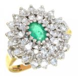 AN EMERALD AND DIAMOND RING the oval emerald 0.4ct approx, the brilliant cut diamonds 0.85ct approx,