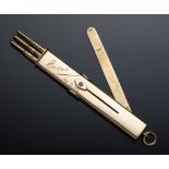 A 9CT GOLD AND ENAMEL RETRACTABLE PENCIL incorporating a letter opener, the three pencil slides with