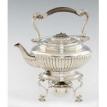 AN EDWARD VII GADROONED SILVER TEA KETTLE ON LAMPSTAND engraved with presentation inscription,