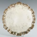 AN EDWARD VII SILVER SALVER on three feet, 35.5cm diam, by Thomas Bradbury & Sons, also marked