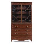 A GEORGE IV MAHOGANY AND LINE INLAID SECRETAIRE BOOKCASE, C1830 with dentil cornice and adjustable