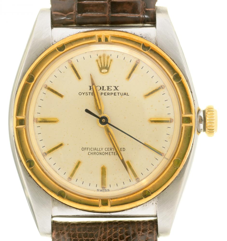 A ROLEX BIMETAL WRISTWATCH OYSTER PERPETUAL No 414098 with 'bubble' back, 3 x 3cm, on leather