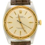 A ROLEX BIMETAL WRISTWATCH OYSTER PERPETUAL No 414098 with 'bubble' back, 3 x 3cm, on leather