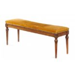 A LOUIS XVI BEECH BANQUETTE, LATE 18TH C with panelled frame raised on tapering, turned fluted