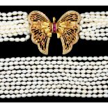 A MULTI STRAND PEARL NECKLACE WITH RUBY AND DIAMOND SET GOLD BUTTERFLY CLASP 84cm l, marked on clasp