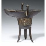 A CHINESE ARCHAISTIC BRONZE TRIPOD RITUAL WINE VESSEL, JUE, QIANLONG MARK AND PERIOD, C1737 16.5cm h