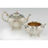 A VICTORIAN GLOBULAR SILVER TEAPOT AND SUGAR BOWL EN SUITE the domed lid with melon knop, teapot